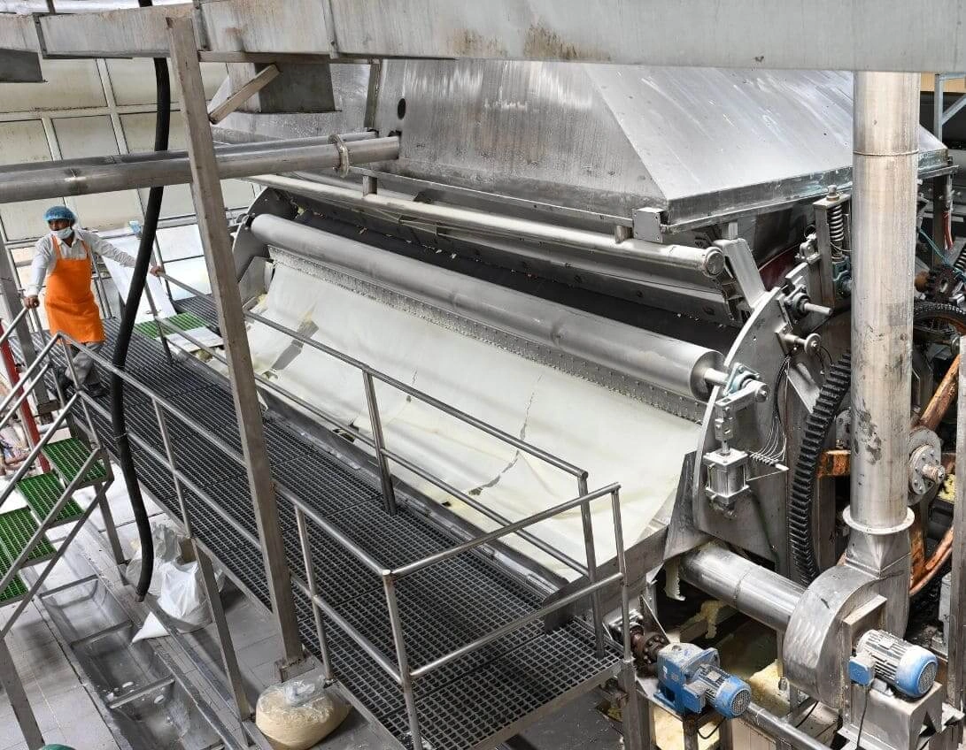 A giant potato machine in action, producing a some potato products