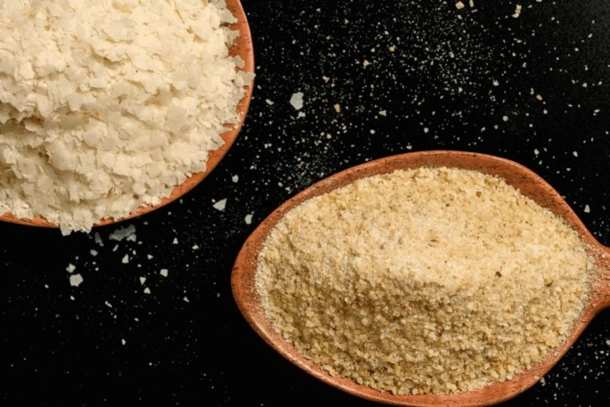 a bowl of potato flakes and a bowl of potato granule .