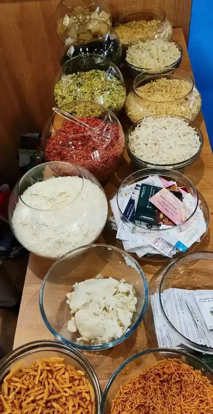 A table with assorted food bowls on display at the Goodrich Exhibition Aahar India.